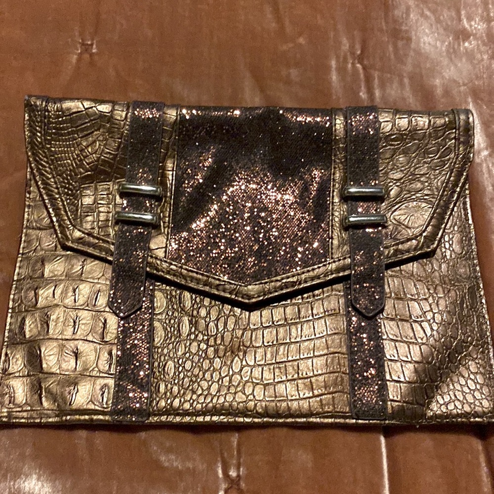 Vintage bronze colored snakeskin clutch with silver chain strap.